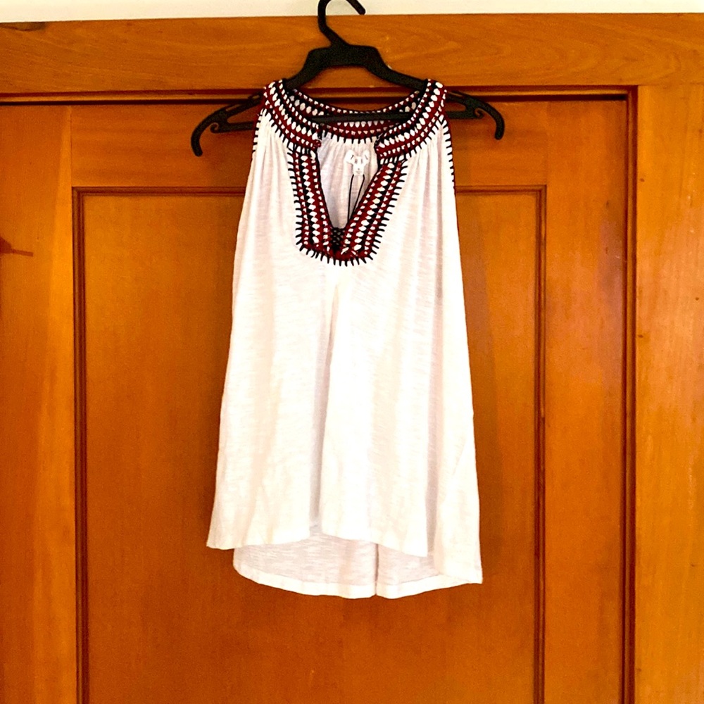 White tank top with red and black accents